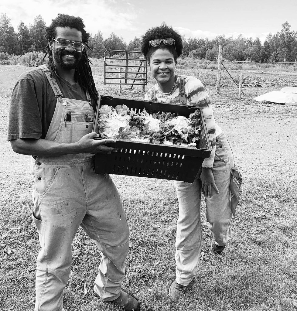 2023’s Future Farmers Michael Miller and Rosa Soriano show off their lettuce harvest. (Photo courtesy Sarah Mayer)